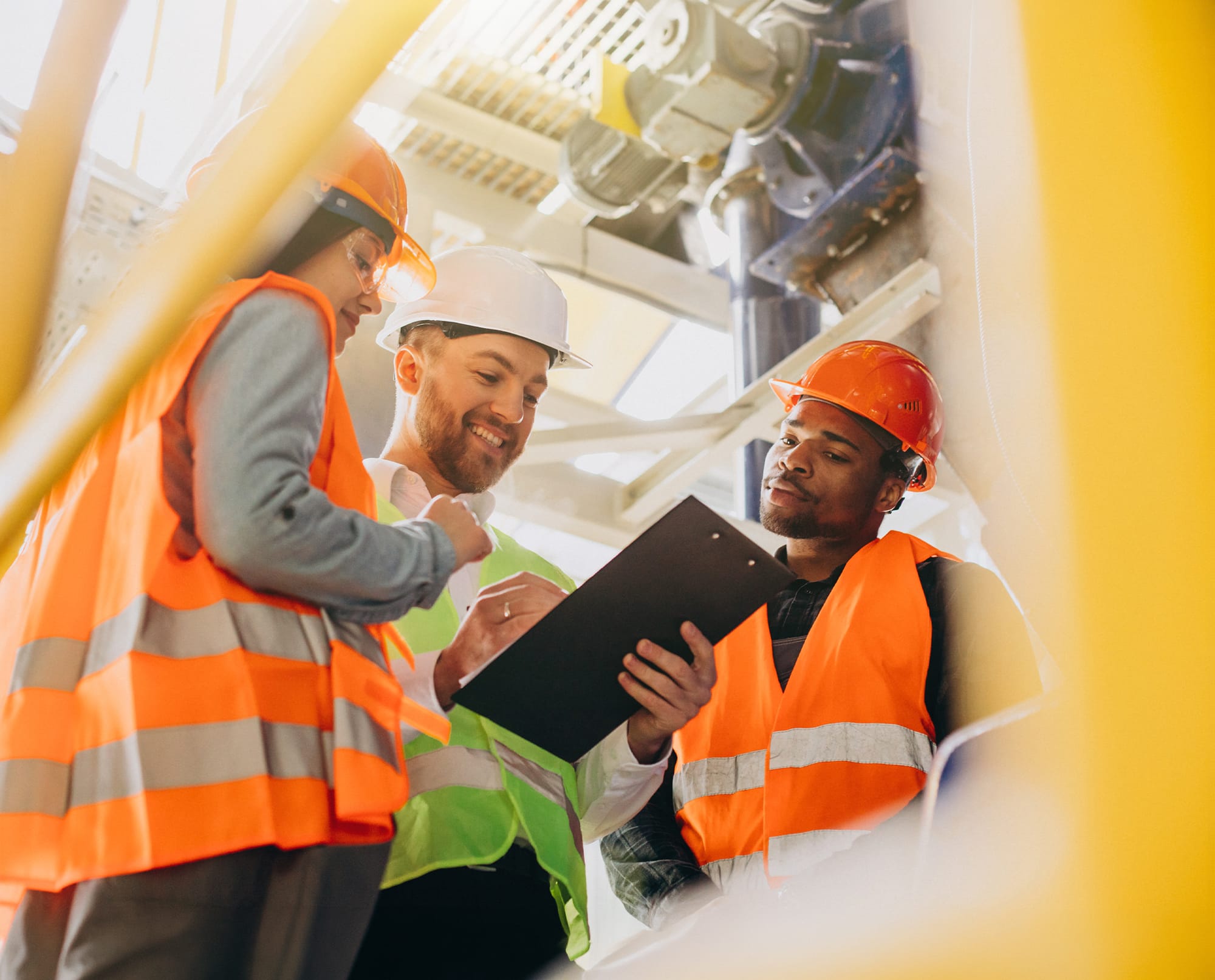 Workers reviewing safety records together on site
