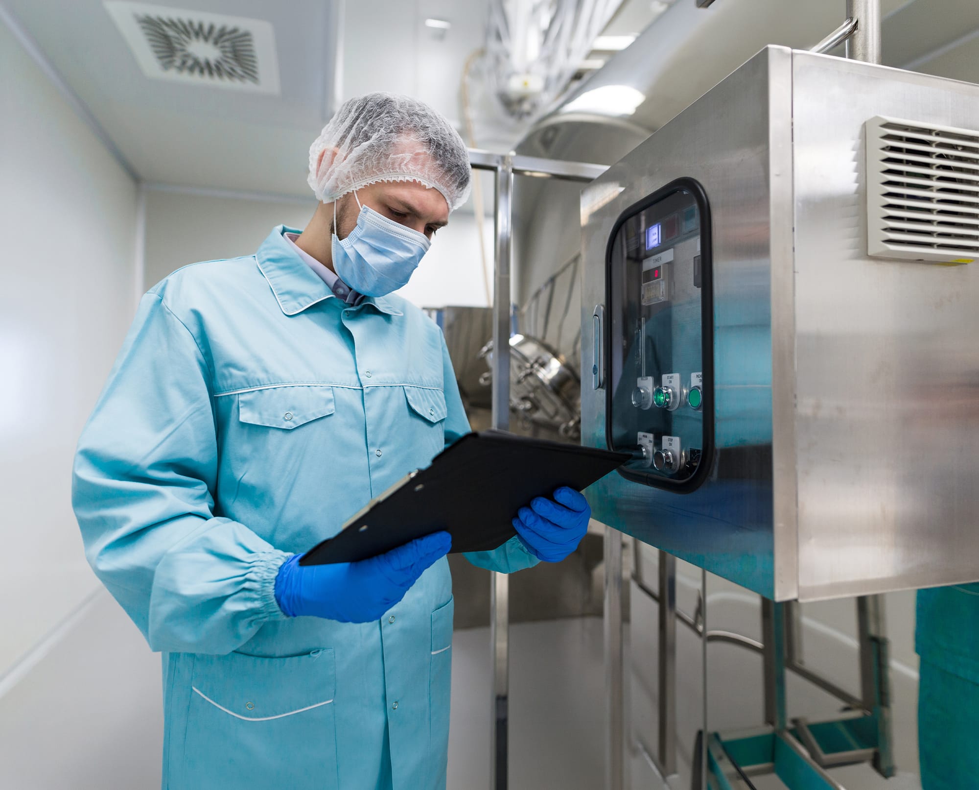 Operator reviewing records on a production line