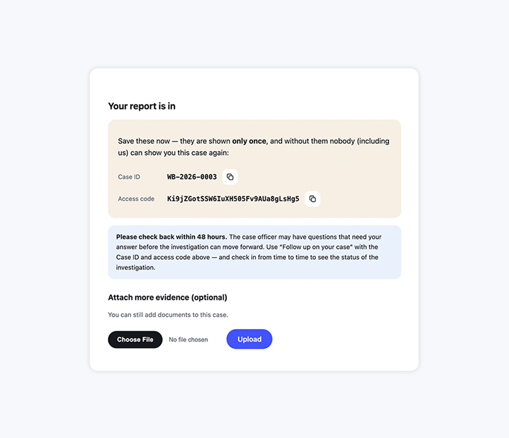 A submitted report's confirmation, with the case ID and access code for following it up
