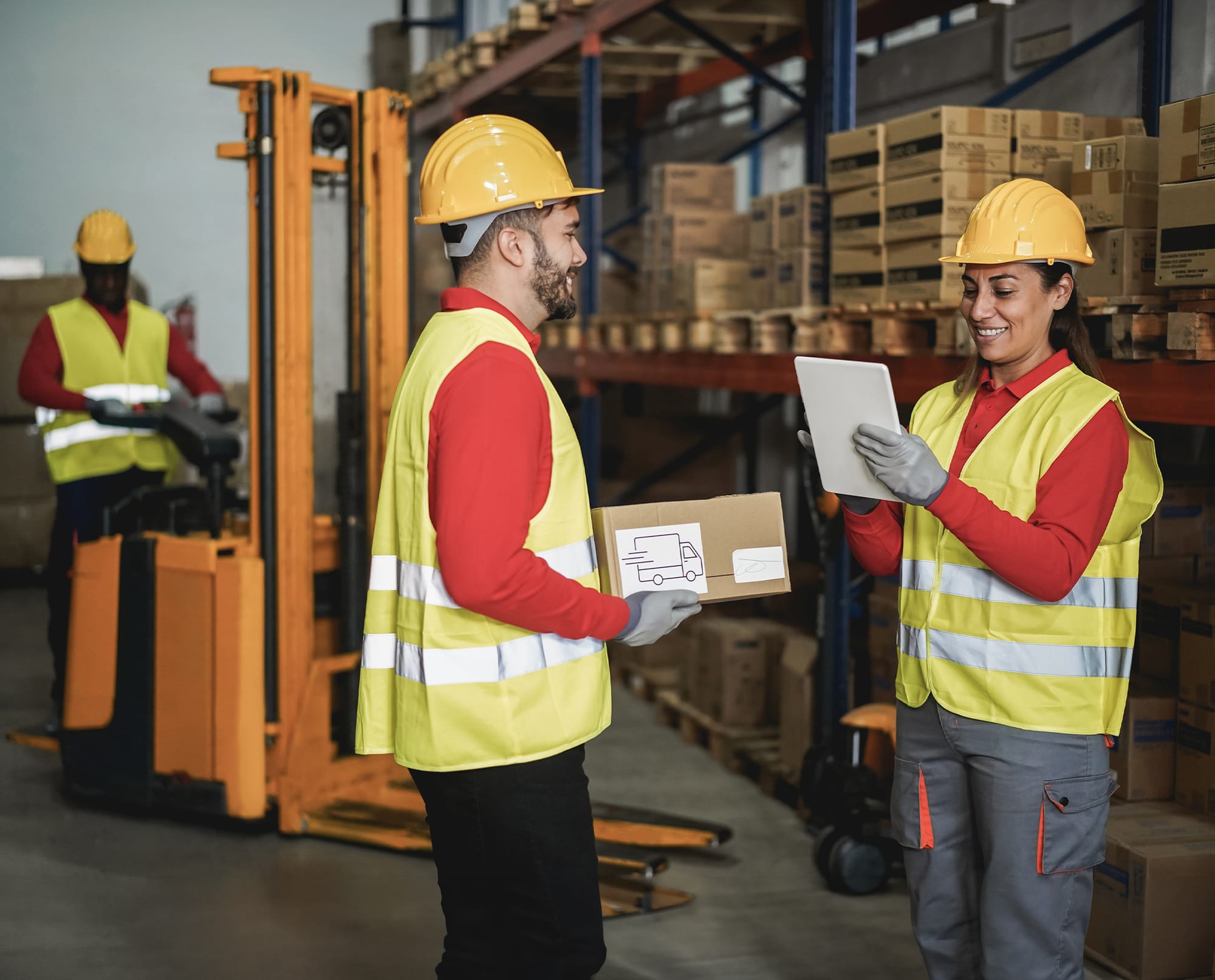 Workers reviewing safety records together on site
